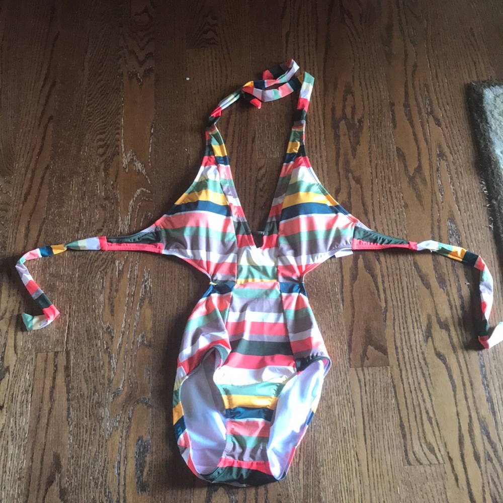 Multi colored one piece swimsuit. Never worn.